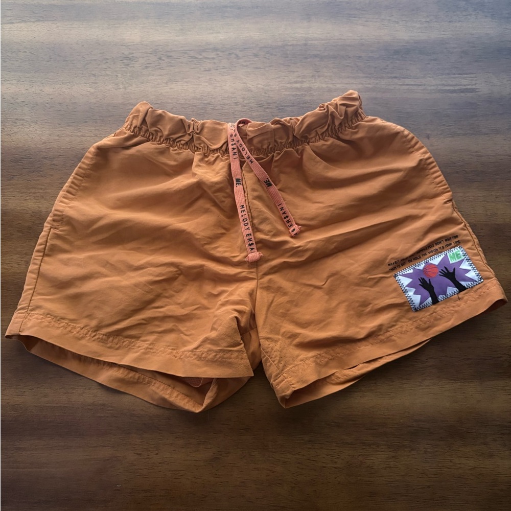 Melody Ehsani Vibrant Orange Athletic Shorts